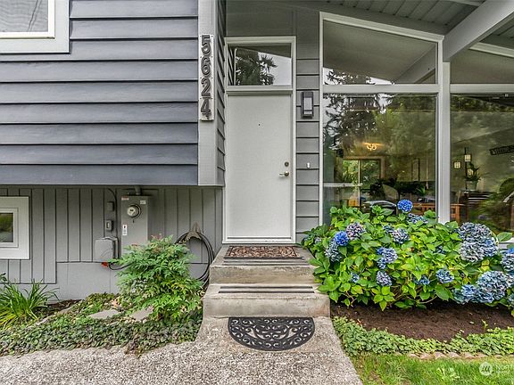 Inviting front Entryway has backlit house numbers!  Your delivery people will always find you, day or night!  I love the oversized front windows.>