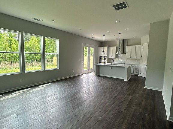 living room view with open kitchen