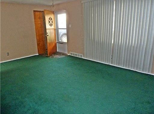 The front entrance opens into this spacious living room