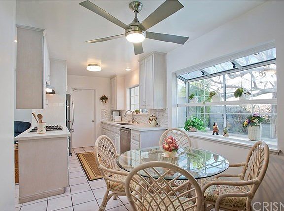 Kitchen dining area with garden window overlooking