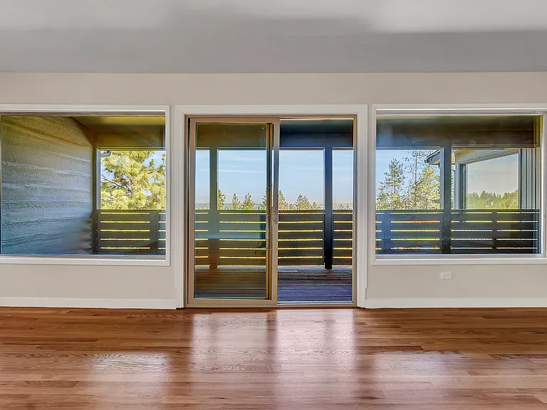 Living room & private balcony deck and hillside view