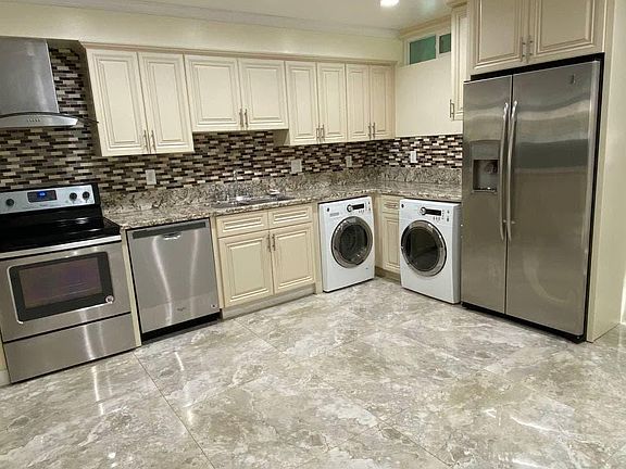 Kitchen with granite counter top, and brand new appliances