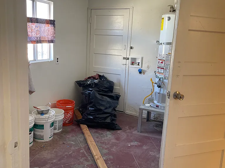 Service Porch with Laundry Area (and Water heater)