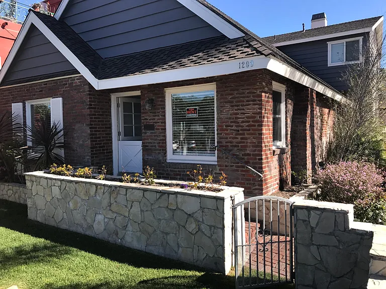 Dutch door with gated front grass yard