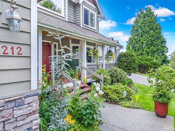 This wrap around covered living area / porch provides cover from the NW weather.  Have long talks on the porch-bench swing or get caught up on your book.
