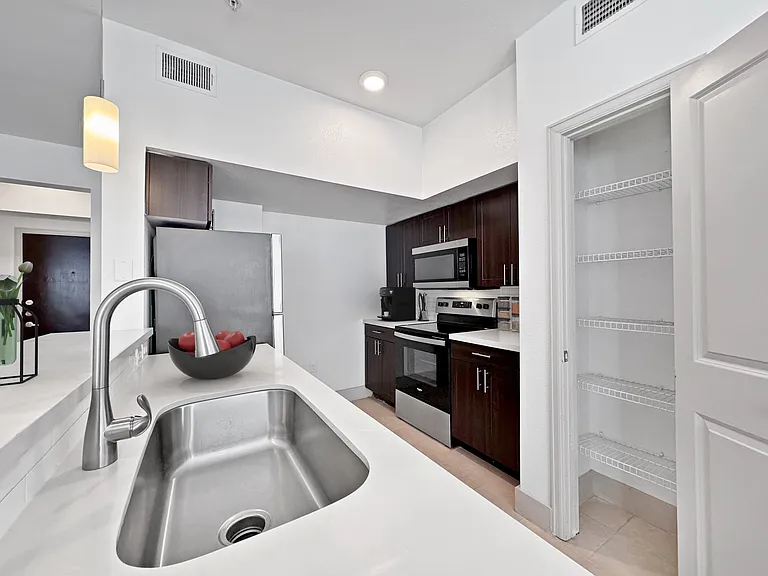 Experience culinary delight in this contemporary kitchen, equipped for modern living. Experience culinary delight in this contemporary kitchen, equipped for modern living.