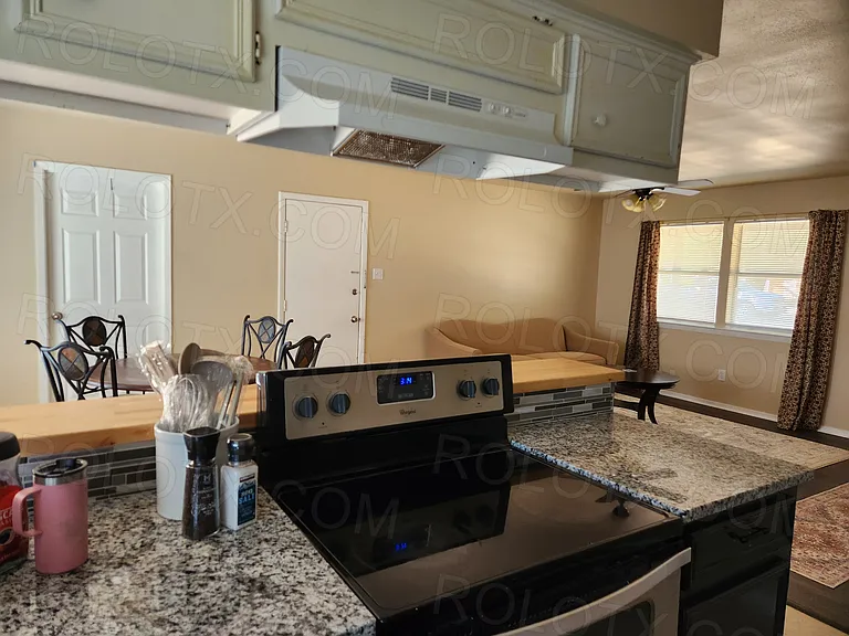 Kitchen, eating area and living room.