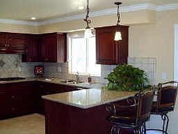 NEW kitchen including Cherrywood cabinets, GE appliances, granite counters, tile splash guards