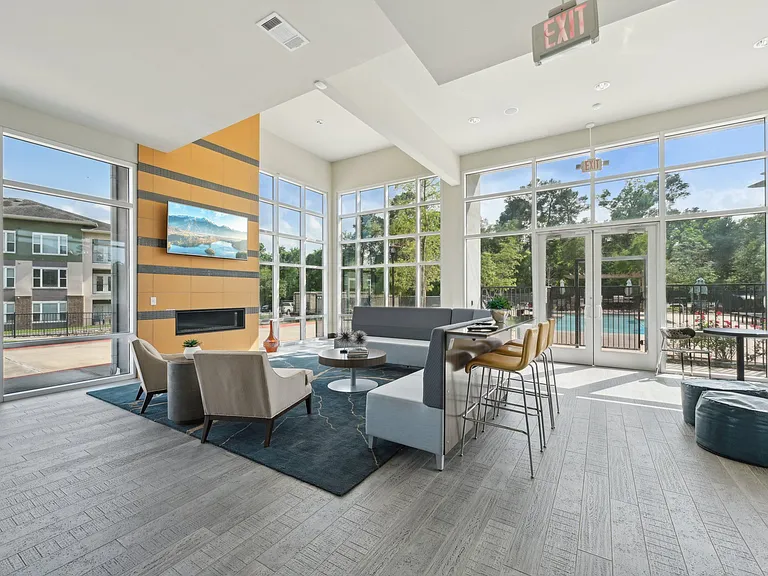 A lovely community room with a coffee bar, TV and a fireplace is a great place to lounge.