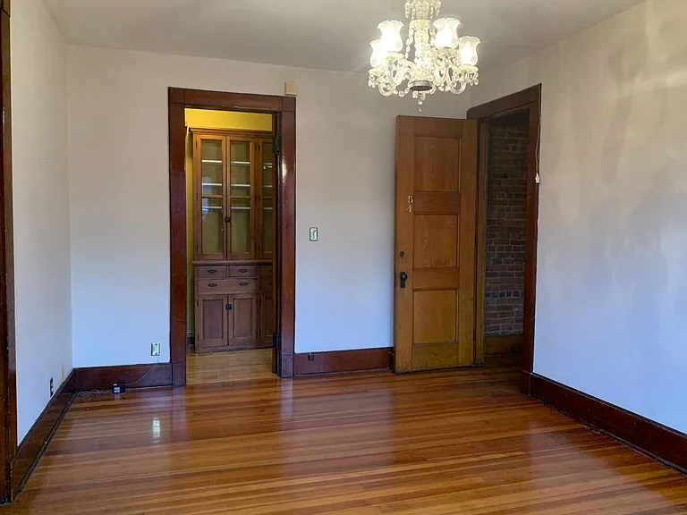 Dining room, view to pantry & hall. Solid-core door to hallway can close for more privacy. Great layout for roommates or work-from-home.