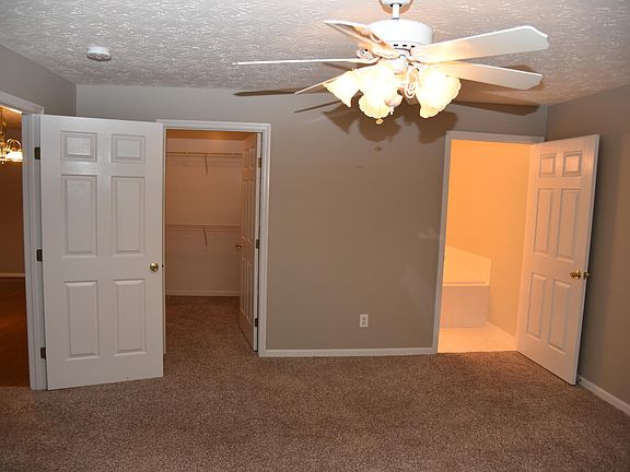 master bedroom with walk in closet