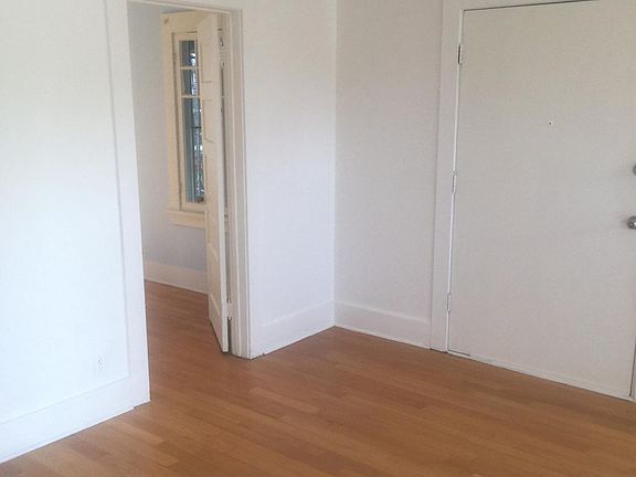 Living room showing access to bedroom.