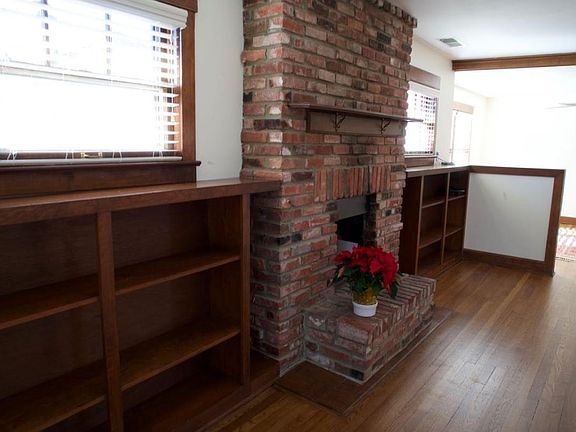 living rom, wood burning fireplace, dining room