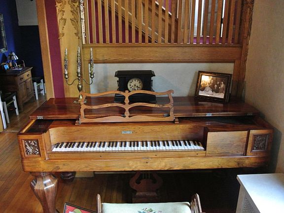 entry foyer, antique piano, staircase