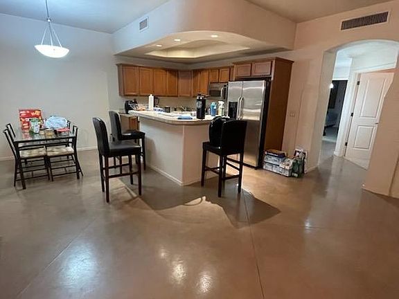 View of proximity of kitchen area from living room area. Great kitchen is considerably larger than it appears in this photo.