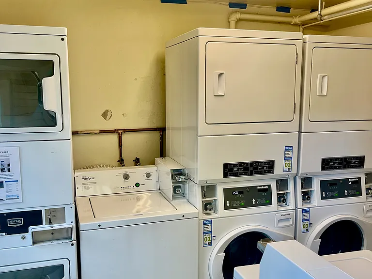 Coin or app operated laundry room now features 4 stackable washer dryers and one additional washer.