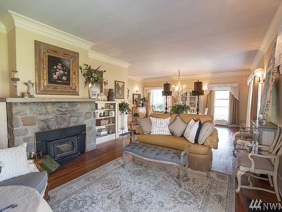 The open floor concept allows a seamless flow between the formal living and dining rooms.  The authentic granite rock fireplace adds true character and a great focal point.  The insert keeps the house warm and cozy in the winter months.