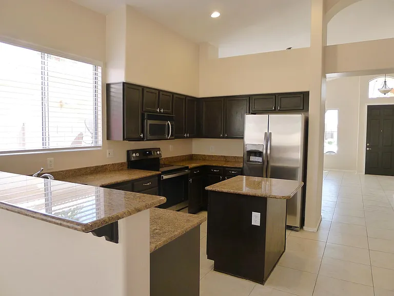 Kitchen with bar seating.