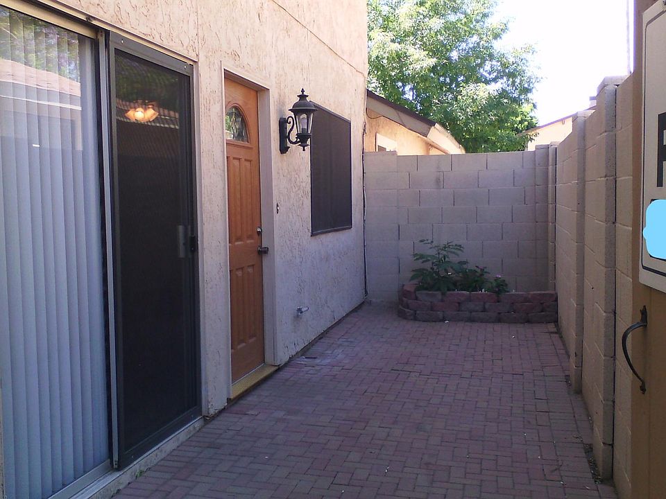 Entry with sliding glass door. Raised bed planter