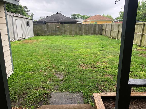 Back yard. Level and free from puddles.