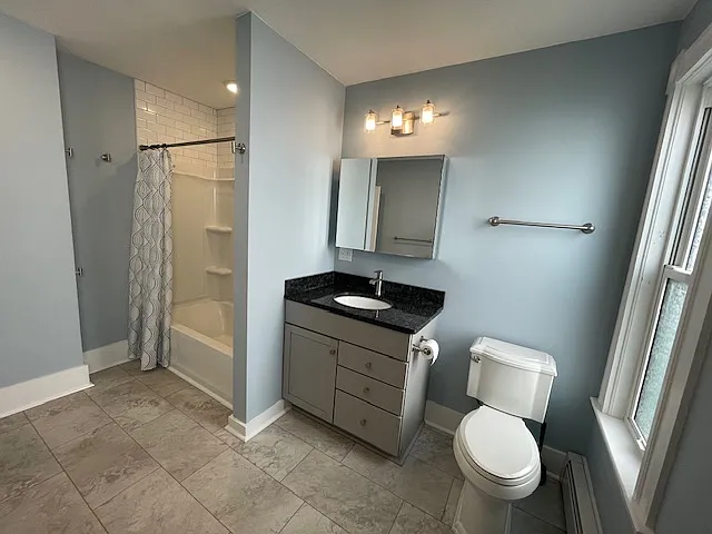 Spacious bathroom with a tub/shower combo