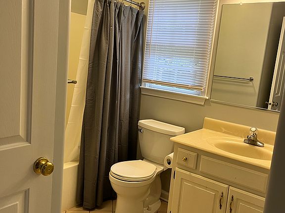 Full bathroom with tile floor