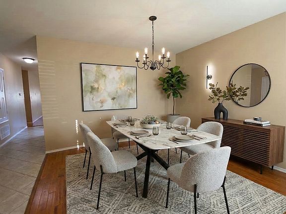 Formal dining area. Virtually staged.