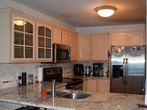 Kitchen with Stainless Steel Appliances & Granite Countertops