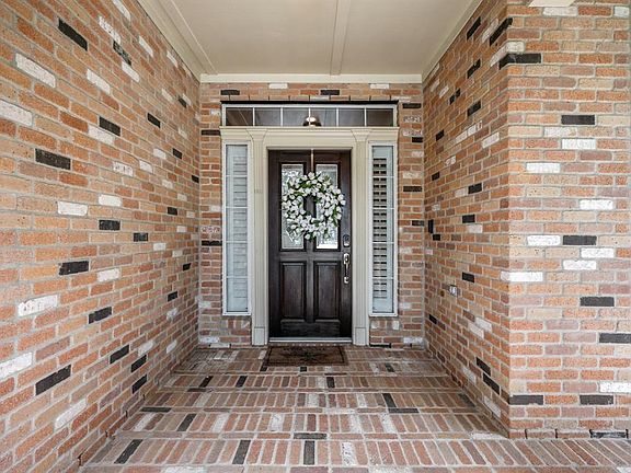 Sit and relax under a shaded covered front porch, beautiful brick elevation. The home has a recent HVAC and roof.