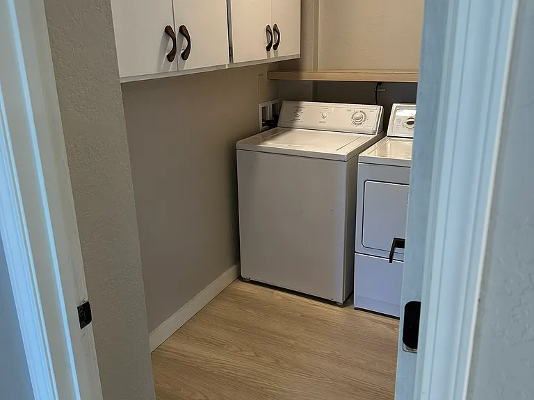 Laundry room with lots of storage and large capacity washer and dryer