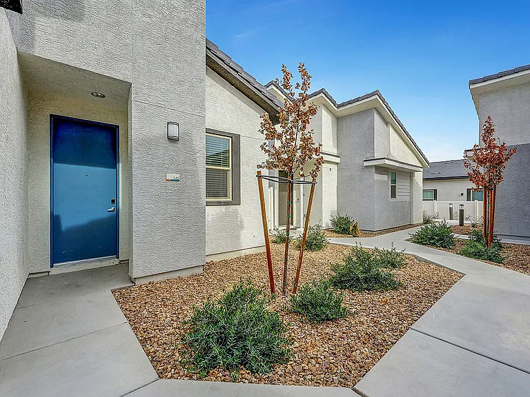 Experience modern architectural design with this stylish and welcoming entrance.