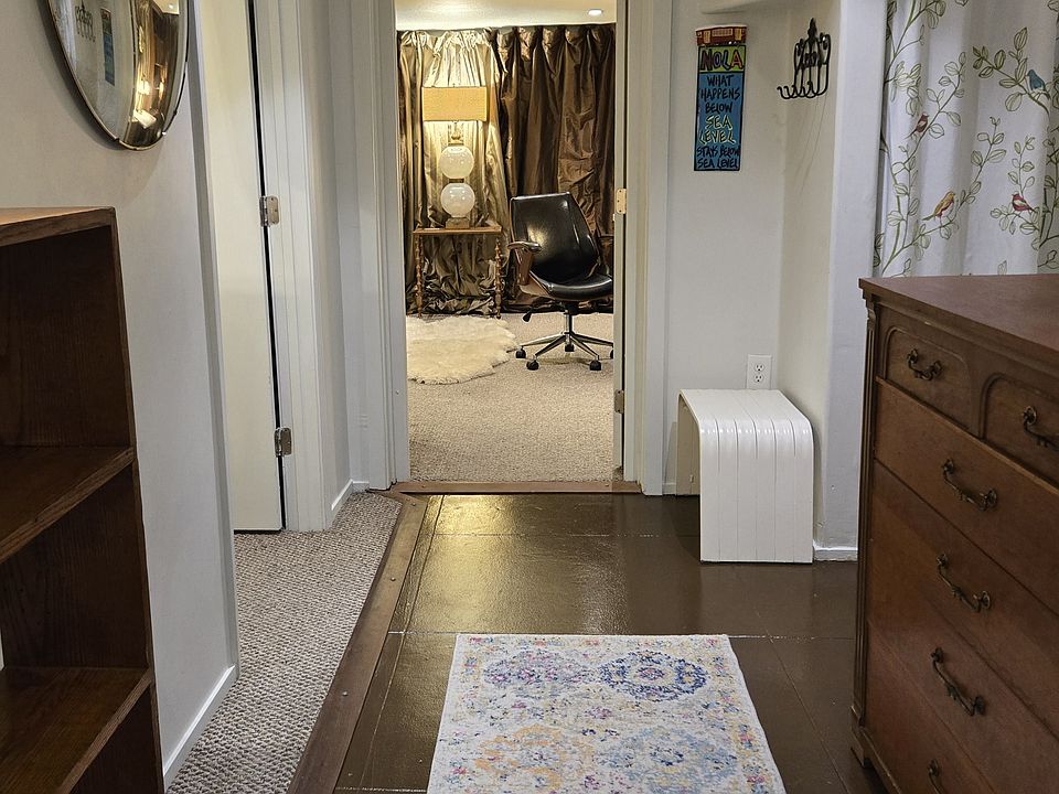 Front Hall Leading to Flex Room, Bedroom, Bathroom and Hallway to Kitchen/Den, Backyard