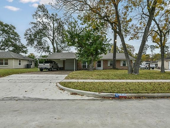 View of property from new paved street and sidewalk.
