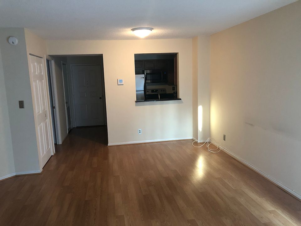 Main room looking into kitchen and front entry