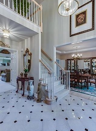 Welcoming open two story entrance foyer