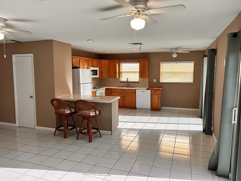 living area to eat in kitchen area