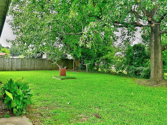 Back Yard- lovely trees offer shade, but not crowding the house!