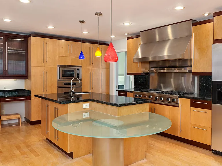 Casual dining peninsula with a glass table top.
