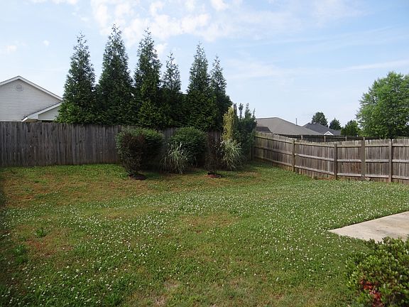 Spacious backyard with fence