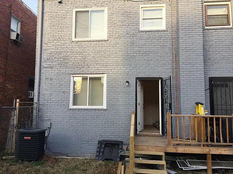 Rear Exit from unit on the main floor to the fenced backyard