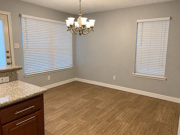Spacious dining room easily fits a 4-6 person table + buffet. Ceramic tile flooring and lots of natural light.
