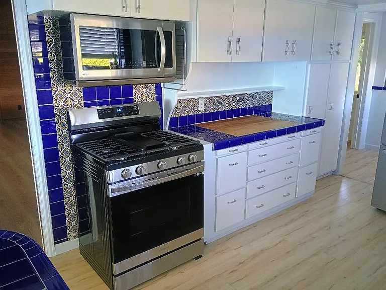 Kitchen (Stove, Microwave, Butcher-Block Counter)