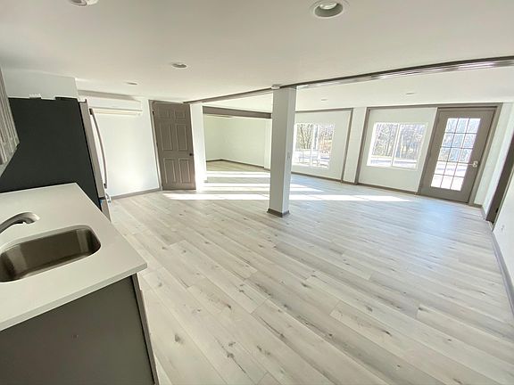 Lower Level Living/ bonus room with kitchenette. Lower level also has 2 large bedrooms and a full bathroom