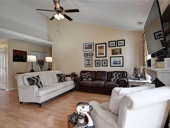 Open floor plan with cathedral ceiling.