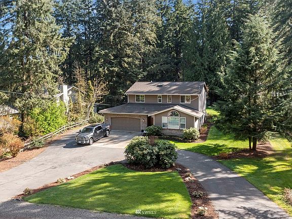 Privacy abounds on this greenbelt lot surrounded by trees and space