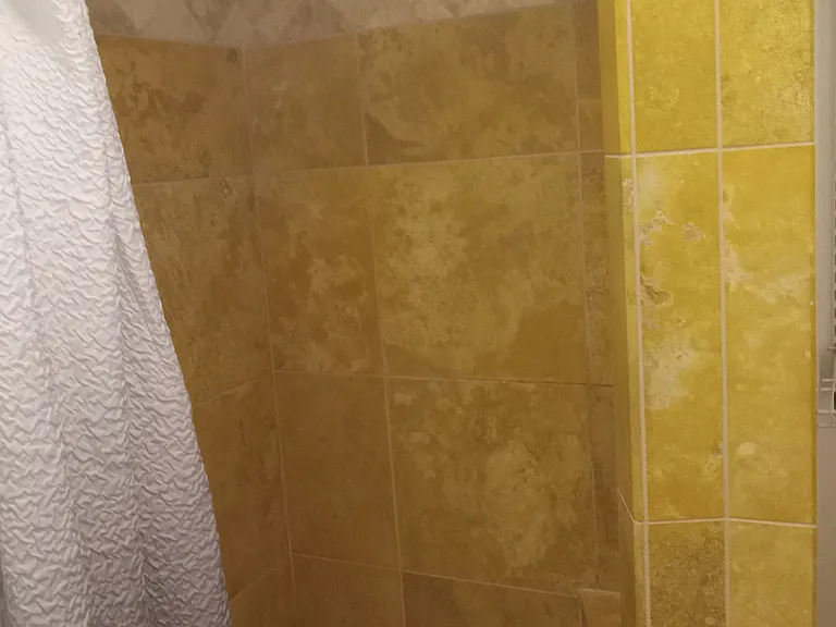 4-foot tiled shower, with a bench