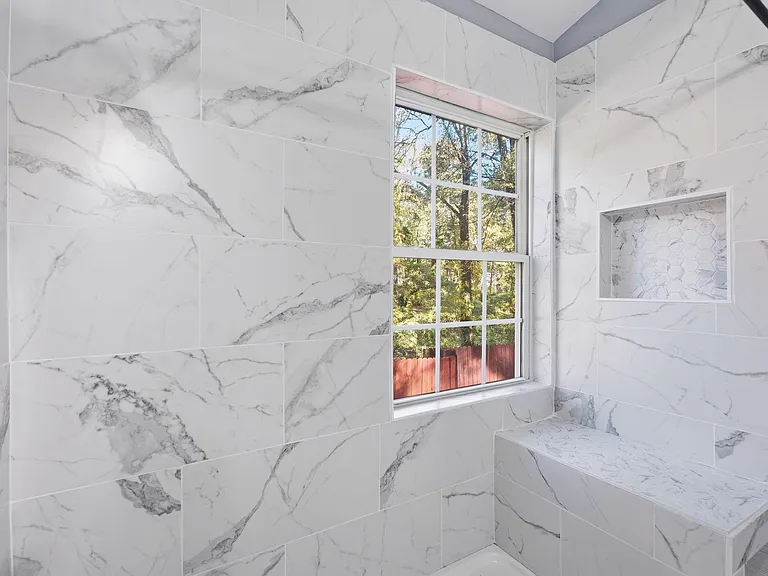 New tiled stand-in shower with sitting bench