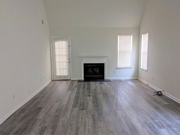 Large living room with access to back deck
