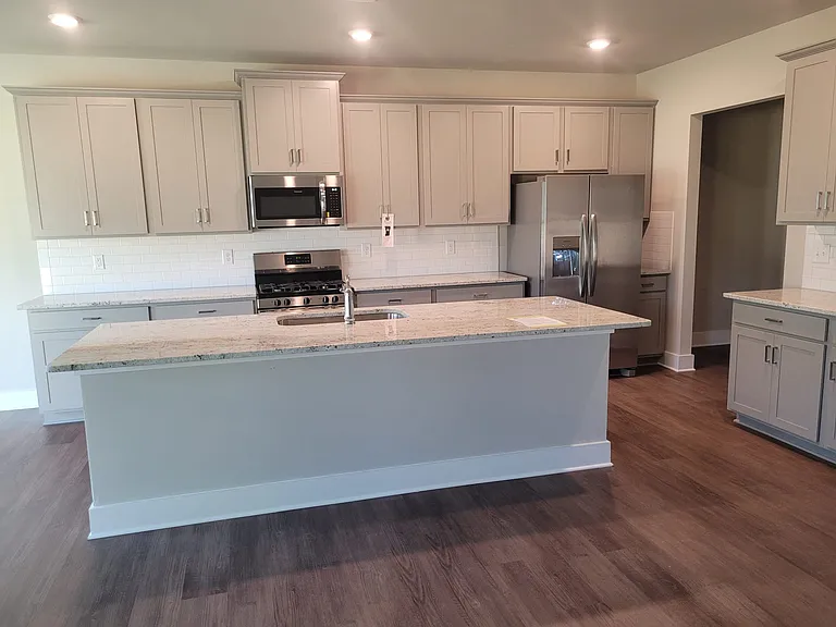 Kitchen with island and spacious pantry