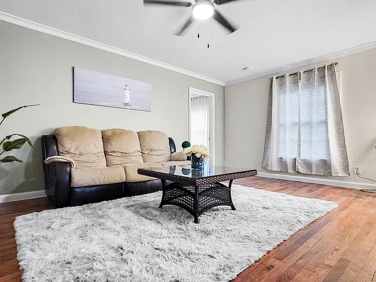 Cozy living room with a comfortable couch perfect for unwinding after a long day.